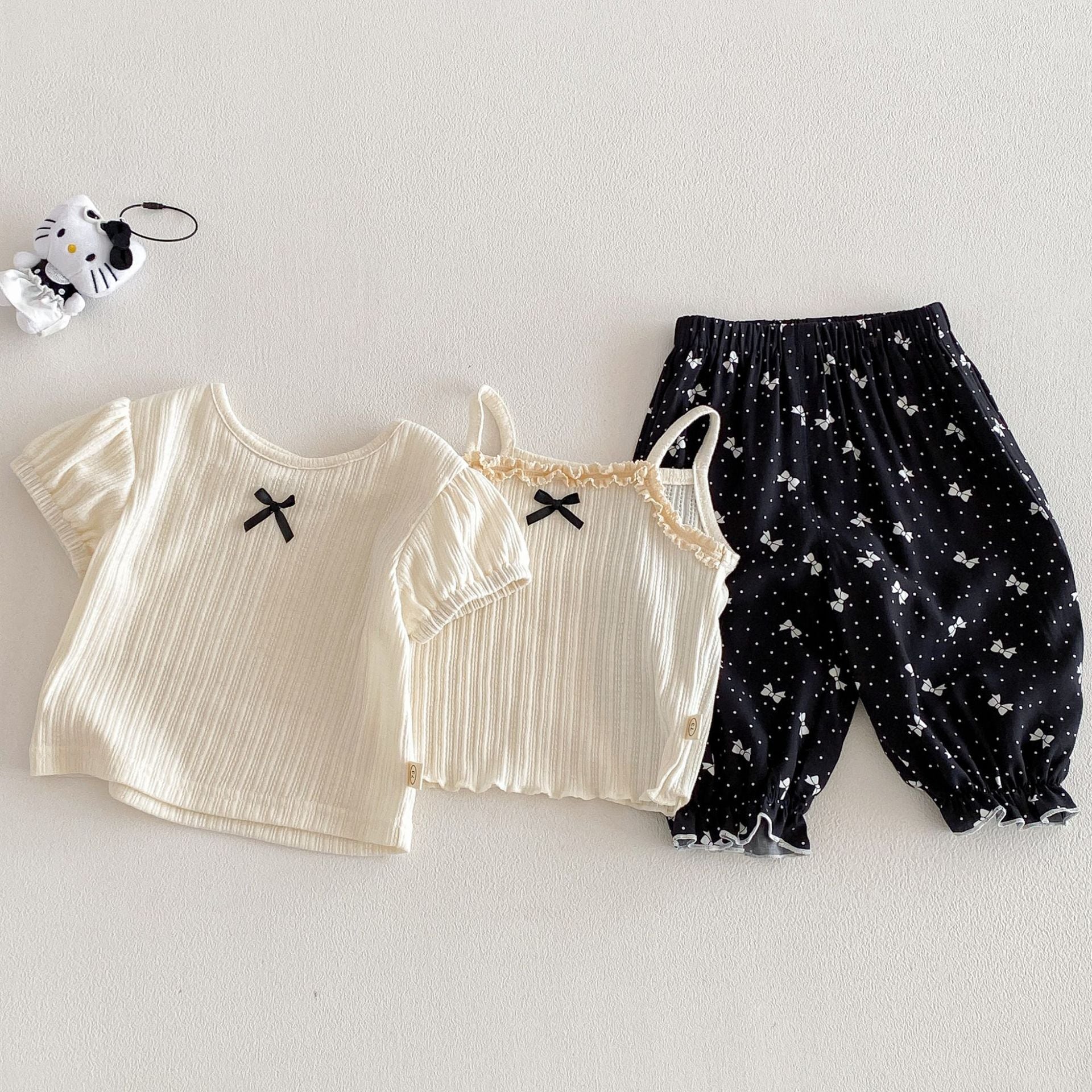 b790803734d0eef74a862ee31816bb83.jpg 【73-110】キャミソールorTシャツorボトムス 蝶結び 女の子 おしゃれ - 画像 (1)